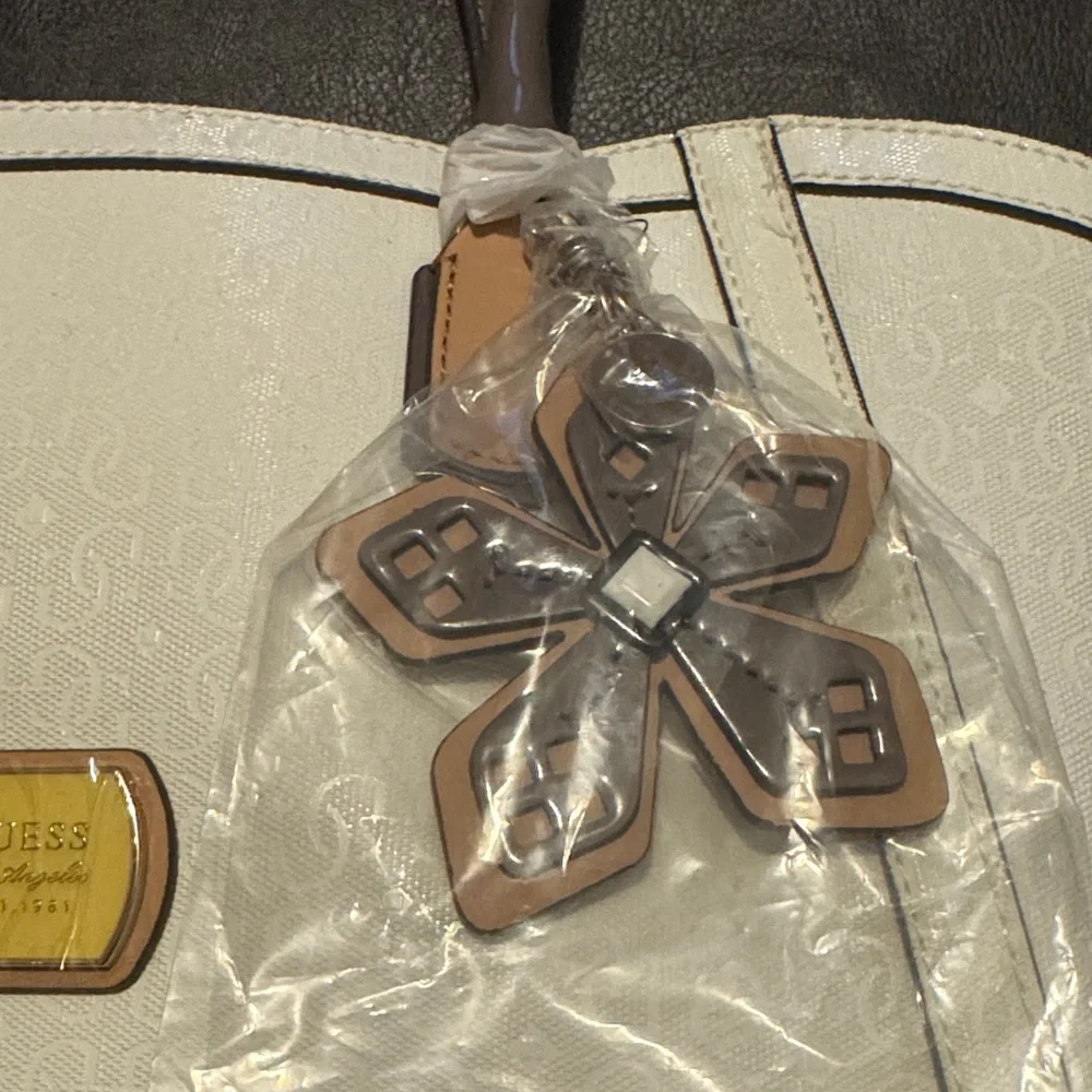 NWT GUESS White, Gray and Tan Tote Bag With Plastic Still On Hardware Plus Charm - Picture 2 of 14